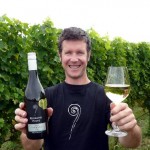 The winning Richmond Plains wine being displayed by wine maker